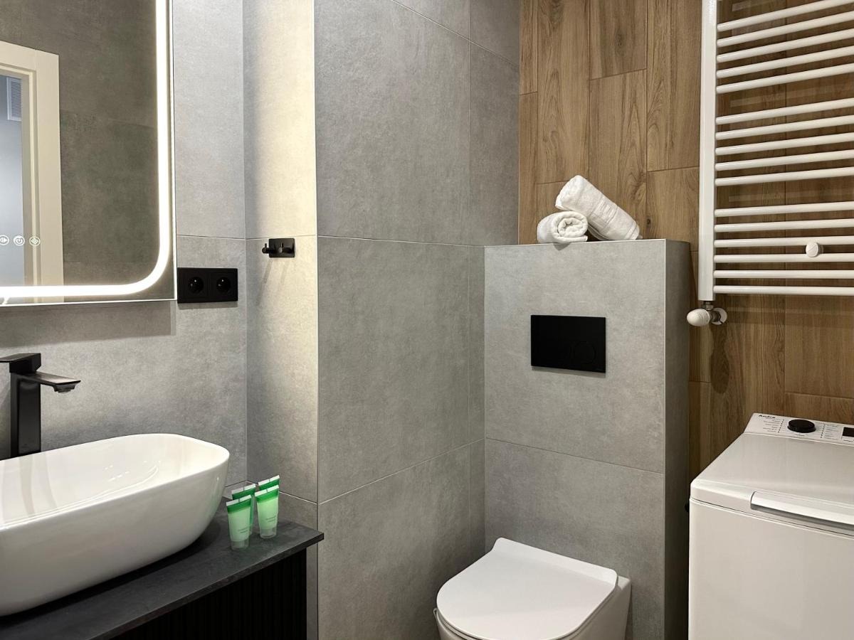 Łazienka z pralką — Hygge Apartment Portovo